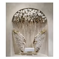 Wall Decorative Design With Arch White Flowers And Golden Wings Hanging Ornaments