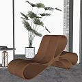 Modern Curved Lounge Chair Interior With Green Plant And Side Table Books