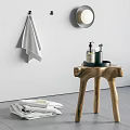 Stylish Bathroom Accessories With White Towel Round Mirror Wooden Stool Black Tray And Bath Products