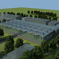 Modern Industrial Factory With Glass Roof And Wall Structures Surrounded By Green Trees
