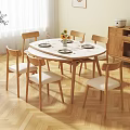 Round White Dining Table Set With Wooden Legs And Six Chairs With White Cushions