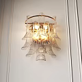 Modern Transparent Petal Design Wall Sconce With Gold Frame And Warm Lighting On White Wall