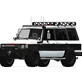 White and Black Off Road Vehicle With Roof Rack and Large Tires in Indoor Setting