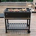Camping Site Outdoor Grill Setup With Dining Table Food And Green Trees