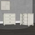 White Dressers with Three Drawers and Metal Handles on Gray Rug and Wall