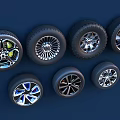 Car Tires With Various Stylish Alloy Wheel Designs Displayed On Dark Background