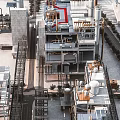 Aerial View of Industrial Factory Building with Multiple Levels Metal Structures and Industrial Equipment
