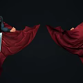 Man in Superman Costume Standing with Red Flowing Cape on Green Column Base