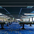 Indoor Sports Fitness Room With Blue Carpet Wooden Wall Blue Chairs And Green Billiard Table