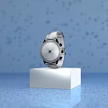 Luxury Black Watch Displayed On Black Square Base Against Blue Background With Blurred Light Spots