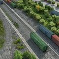 Colorful Freight Train With Green And Red Cars On Rail Tracks Surrounded By Trees