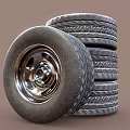 Car Tires Stacked with One Leaning Tire Featuring Metal Wheel Rim