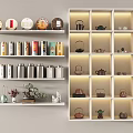 Stylish Teaware Display with Tea Cakes Teapots Caddies and Potted Plants on White Shelves