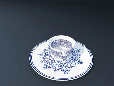Blue And White Ceramic Cup And Saucer With Decorative Floral Patterns 3d model