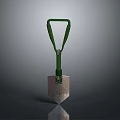 Shovel With Green Handle And Metal Blade On Dark Reflective Surface