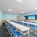Modern Classroom Interior With Light Blue Walls White Tables And Blue Chairs