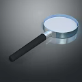 Magnifying Glass With Black Handle And Clear Glass Lens On Gray Surface