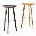 Light And Dark Wooden Bar Stools With Round Tops And Three Legs Design