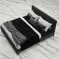 Modern Double Bed With Dark Headboard Black Quilt Gray Throw And Pillows On Marble Floor
