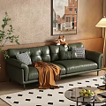 Green Leather Two Seater Sofa With Pillows Throw Blanket Potted Plant Floor Lamp And Wall Painting
