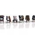Six Chairs With Different Clothes Arranged On Simple White Background