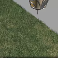 Lantern Shaped Chandelier With Yellow Light Casting Shadow On Wall Above Grass
