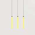 Three Yellow Long Strip Chandeliers Hanging Against Gray Background