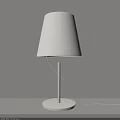 White Table Lamp With Fabric Shade Slim Pole And Round Base On Gray Wall Background