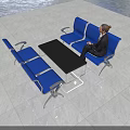 Blue Public Chairs In Modern Lobby Area With Woman Sitting And Coffee Table