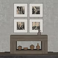 Four Framed Artworks Hanging Above Wooden Console Table With Ceramic Pots And Bowl