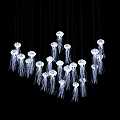 Jellyfish Shaped Chandelier Cluster With Hanging Illuminated Tentacle Details Against Black Background