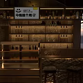 Cozy Roadside Bar with Outdoor Seating Tables Chairs and Warm Exterior Lighting Design
