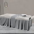 Beige Massage Bed Featuring Gray Towel Pendant Light and Green Plant on Gray Tiles Floor