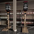 Modern Bar Interior Design With Wine Racks Hanging Glasses And Wooden Bar Stools