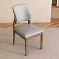 Light Gray Upholstered Dining Chair With Wooden Legs In Modern Living Room Setting