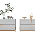 Modern White Nightstand With Gold Accents Drawer Design Green Plant Magazine Sculpture And Bowl