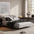 Double Bed In Modern Bedroom Interior With Gray Pillows Black Blanket Sunlight Painting And Dresser