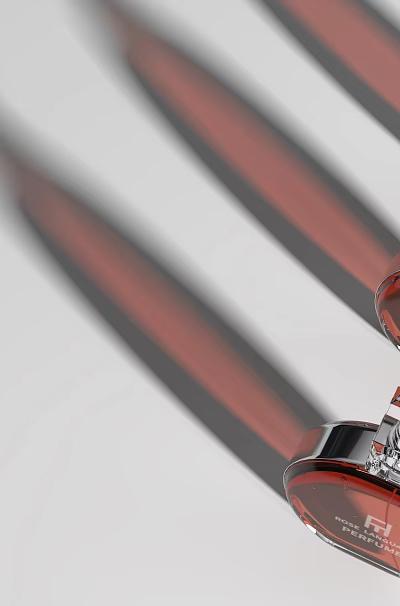 Three Red Perfume Cosmetics Bottles With Silver Caps And Brand Labels 3d model