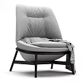 Gray Leisure Chair with High Back Pleated Plush Cushion Dark Wooden Legs and Patterned Blanket