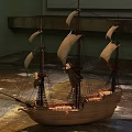 Wooden Sailboat Model With Multiple Sails And Detailed Hull On Indoor Floor