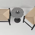 Two Woven Stools with Black Wooden Frames and Round Black and White Geometric Pattern Table
