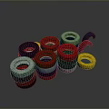 Colorful Circular Rings in Different Colors Stacked Together Against Black Landscape Background