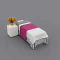 Comfortable Massage Bed With Pink And White Sheets And Orange Flowers On Bedside Table