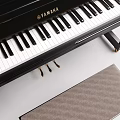 Elegant Black Yamaha Piano With Black Stool And Beige Cushion For Musical Instrument