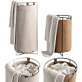 Two Different Colored Fabric Laundry Baskets With Towels And Metal Frames