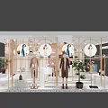 Elegant Clothing Store Window Display With Mannequins Plants Golden Frames And Circular Decorations