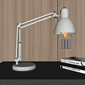 White Adjustable Desk Lamp on Dark Table with Wooden Wall and Books