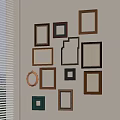 Various Colored Wooden Photo Frames Arranged On Wall With Different Shapes