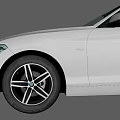 White BMW Hatchback Car With Sleek Exterior And Black Alloy Wheels