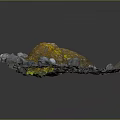 Large Natural Rock With Yellow Spots Surrounded By Small Stones And Pebbles